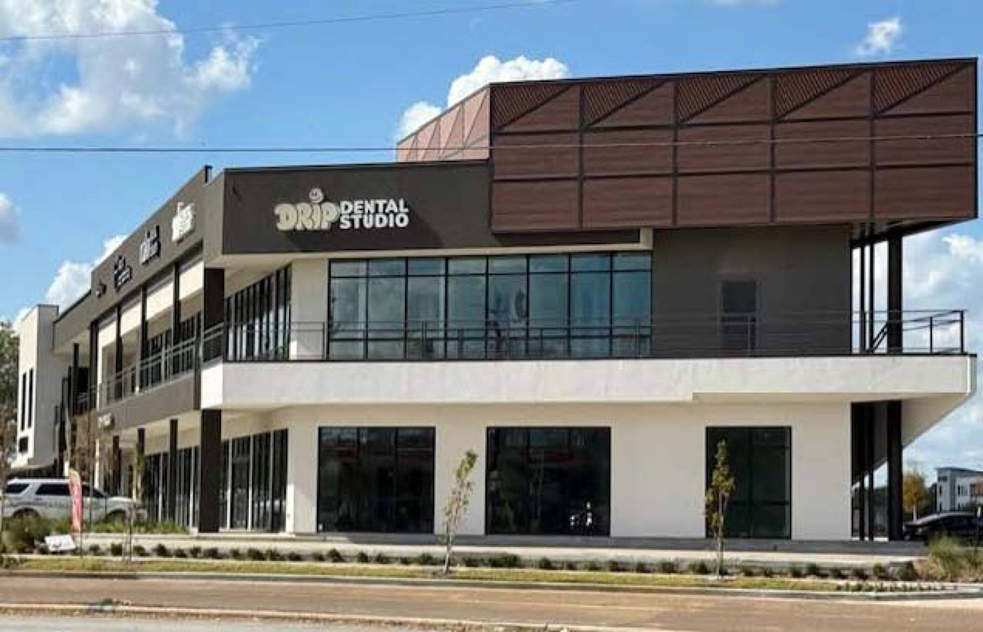 Drip Dental Studio two-story building with extensive window walls